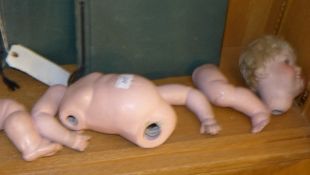 A German porcelain and papier mache doll