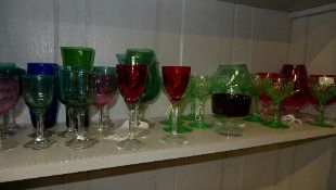 A collection of coloured drinking glasses