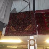 An extremely fine North West Persian Sarouk carpet the pendant floral medallion with Shah Abbas