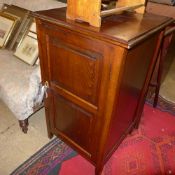 A C19th mahogany side cabinet fitted single panelled door enclosing shelves