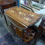 An Italian marquetry inlaid drinks trolley