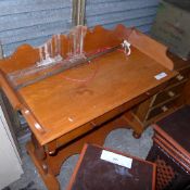 A Victorian mahogany washstand the gallery top above drawers on stretchered supports (a/f)