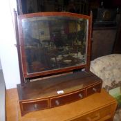 An Edwardian spring plate toilet mirror, and an oval mirror