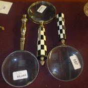 Two magnifying glasses one with chequered handle the other with baluster handle