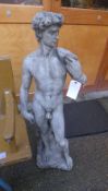 A reconstituted stone garden statue of a classical male