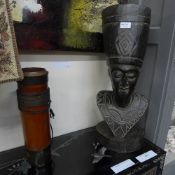 A carved African bust and a quiver