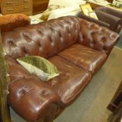 A Chesterfield sofa upholstered in brown button leather