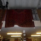 A fine South West Persian Qashgai carpet the central pendant medallion on a terracotta field guarded