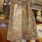 A tapestry on pole of a country mansion