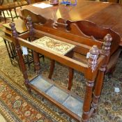 A Victorian mahogany stick stand with tile inset and metal drip tray