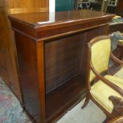 A Victorian mahogany floor standing bookcase with three adjustable shelves and six supports