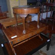 An inlaid yewood low table in the form of a sofa table and a mahogany circular low table of