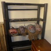 An ebonised three tiered bamboo bookcase with open shelves