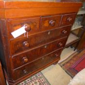 A C19th walnut chest having two short above three long drawers on turned feet