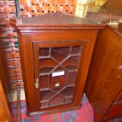 A George III design mahogany corner cabinet with astragal glazed panel
