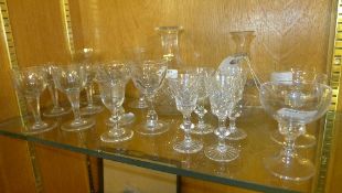 A quantity of glassware including sherry glasses and carafes
