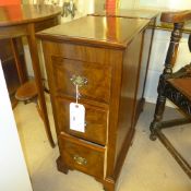 A pair of C20th walnut bedside chest having three drawers on bracket feet