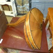 A pair of C19th continental walnut demi-lune console tables on slender support
