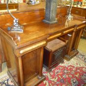 An early Victorian sideboard with three drawers and cupboard with turned columns