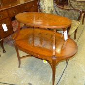 An Edwardian satinwood etagere of two oval tiers well inlaid and raised on slender tapering supports