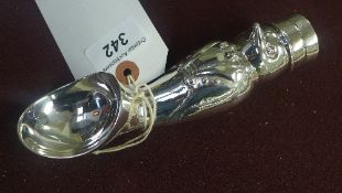 A silver plated penguin form ice cream