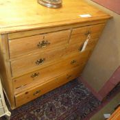 A pine chest having two short above three long drawers on turned feet