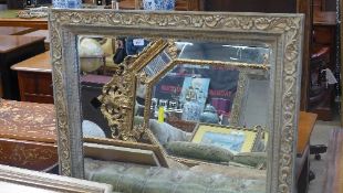 A wall mirror the painted carved frame with bevelled plate