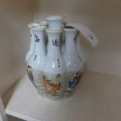 A Chinese pottery tulip vase decorated with immortals and calligraphic decoration