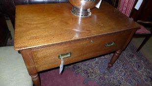 A late C19th mahogany side table the rectangular top above deep drawer raised on turned supports