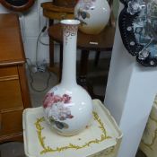 A garniture of three stem vases with floral patterns