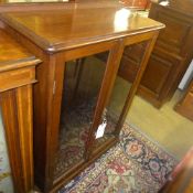 A late C19th mahogany dwarf bookcase with glazed panels on plinth base