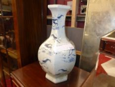 A pair of blue and white Chinese style vases with lobster decoration