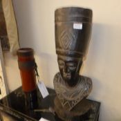 A carved African bust and a quiver