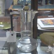 A silver plated dresser style claret jug