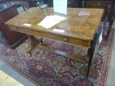 A Victorian walnut library table the rectangular top above frieze drawer on stretchered support