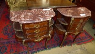 A pair of inlaid bedside chests with three drawers and marble top