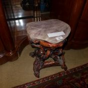 A quartz and rosewood stool