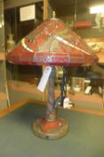 A Tiffany lamp with dragon fly decorated shade