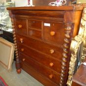 A Victorian mahogany Scottish chest having an arrangement of drawers on turned feet