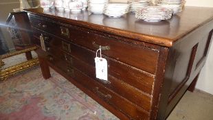 A C20th hardwood four drawer plan chest on stand