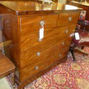 A Victorian mahogany chest having two short above three long drawers on feet