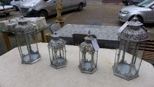 A set of four Vienna design storm hanging lanterns