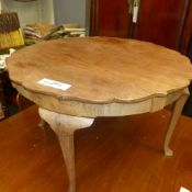 A Queen Anne style walnut low table undulating top, raised on cabriole support