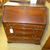 A George II red walnut bureau the fall front above four drawers on bracket feet