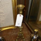 A pair of brass pricket candlestick on tripod supports