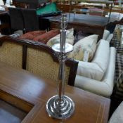 A pair of round base plated table lamps on circular base