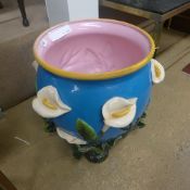 A Majolica style jardiniere with lily decoration