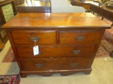 A late Victorian walnut chest having two short above two drawers on plinth base