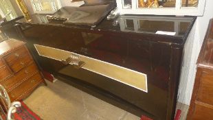 A C20th ebonised designer cabinet.