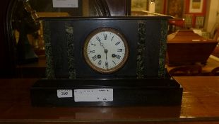 A Victorian slate mantle clock with Arabic numeral dial